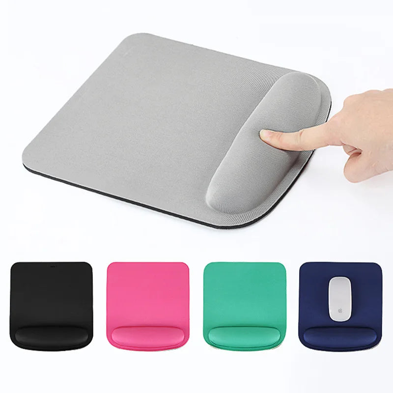 Ergonomic mouse pad with wrist support cushion, shown in grey with hand pressing wrist rest