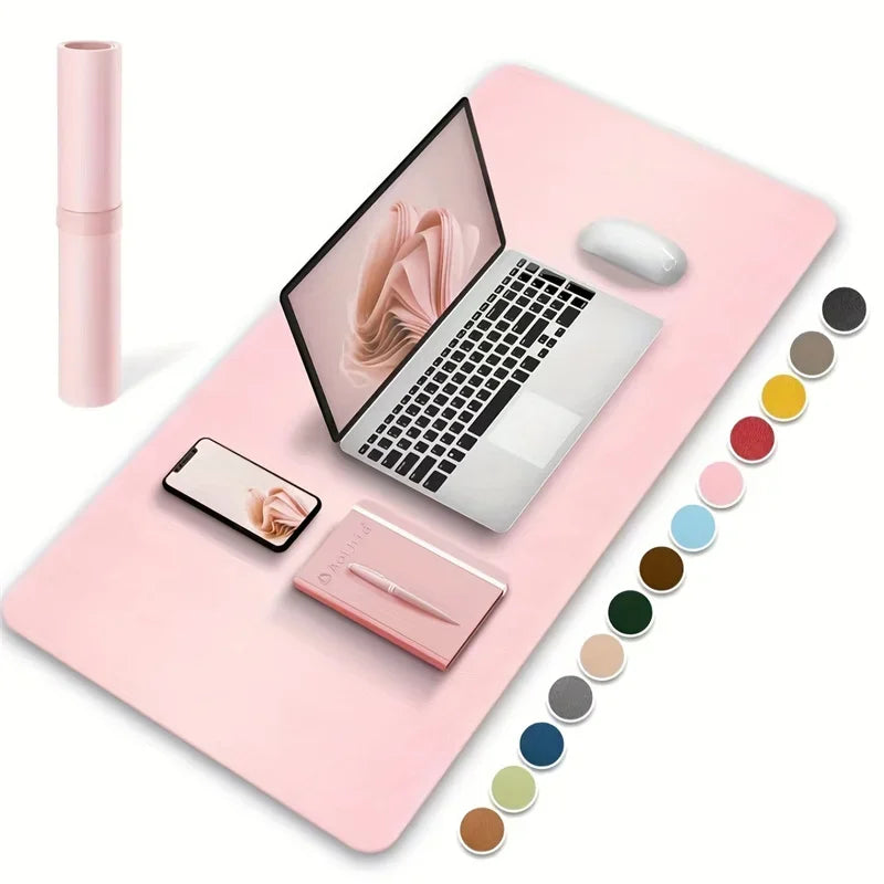 PU leather waterproof desk mat in pink shown with laptop, phone and desk accessories